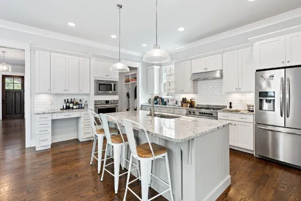 a bedroom with a bed a table and chair