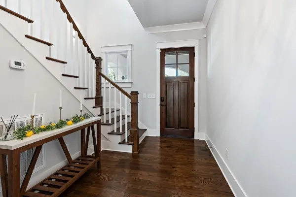 a living room with furniture wooden floor and a fireplace