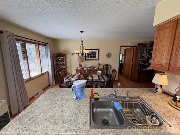 a kitchen with a sink and a refrigerator