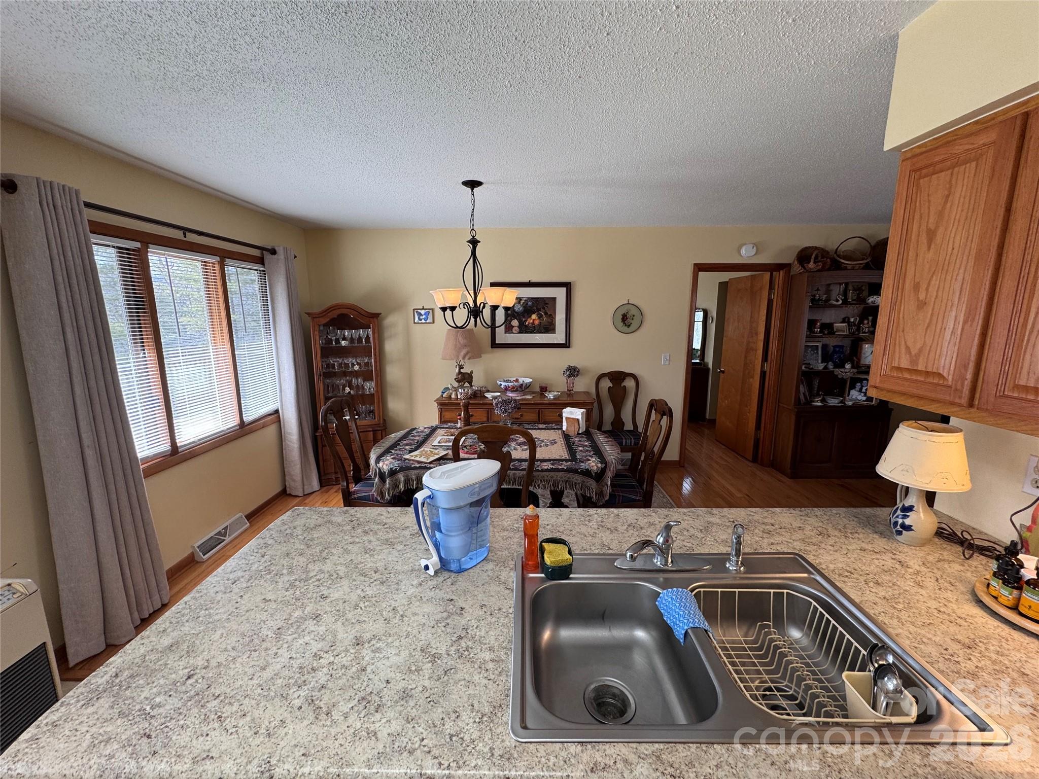 35 Azalea Drive Spruce Pine, NC 28777 - Photo 11 of 35 a kitchen with a sink and a refrigerator