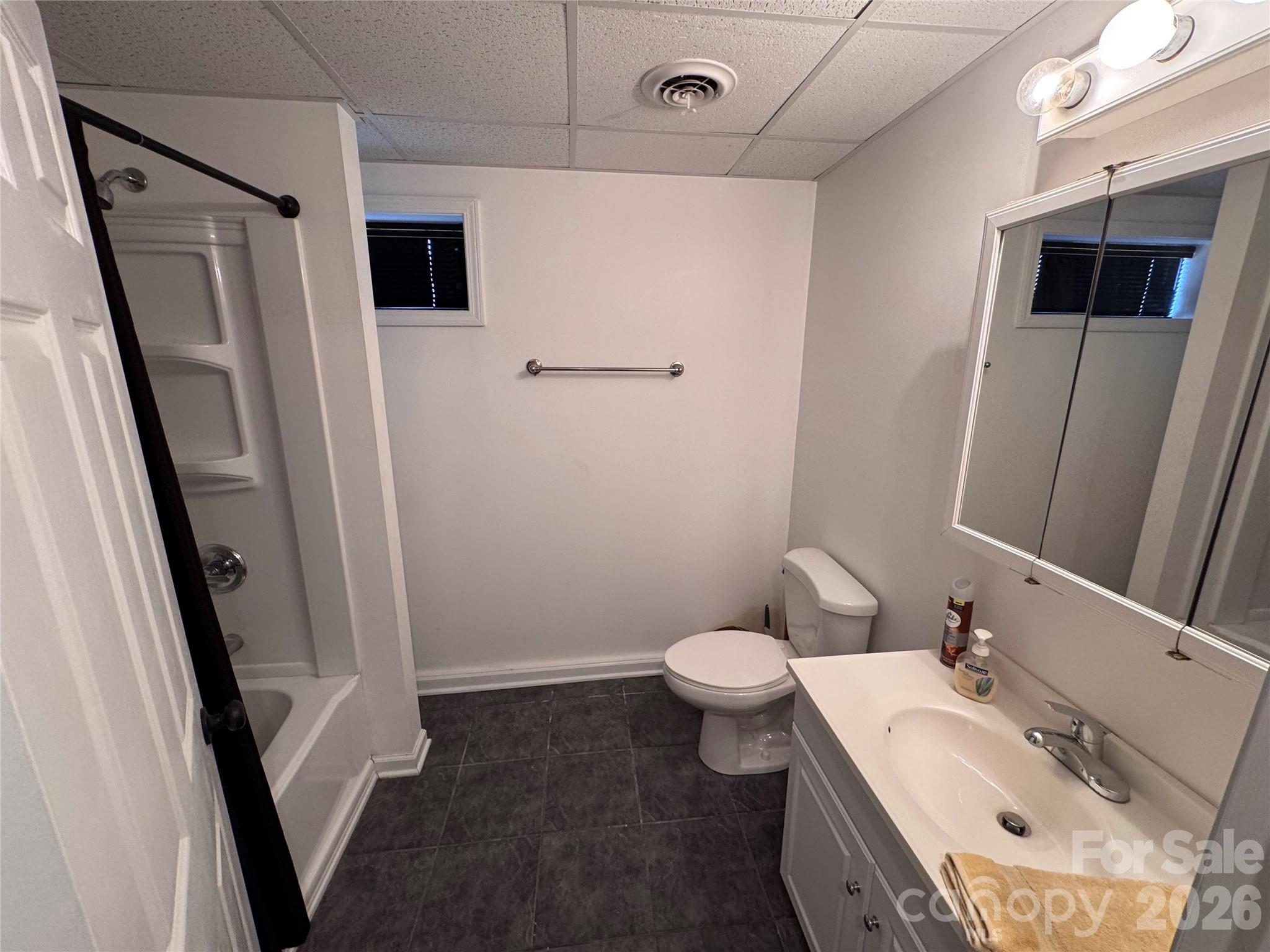 35 Azalea Drive Spruce Pine, NC 28777 - Photo 28 of 35 a bathroom with a sink toilet and shower