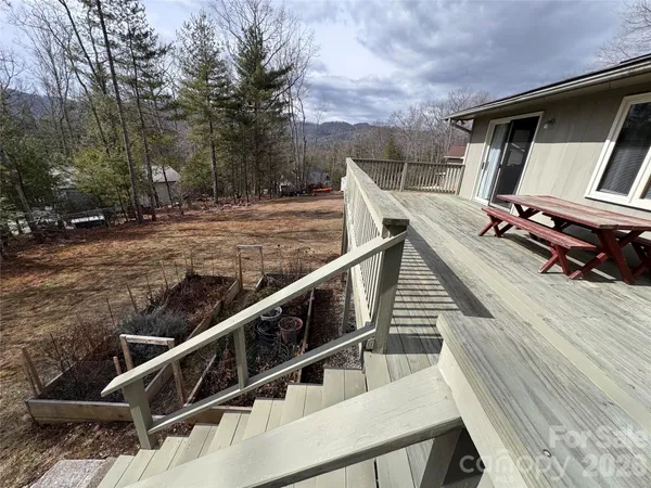 a view of deck with wooden floor and chair