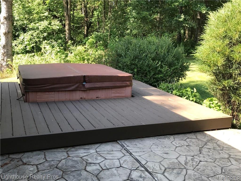 7150 Denton Hill Road Fenton, MI 48430 - Photo 21 of 47 Hot tub deck. Hot tub does not function but seller will remove if buyer doesn't want to repair it.