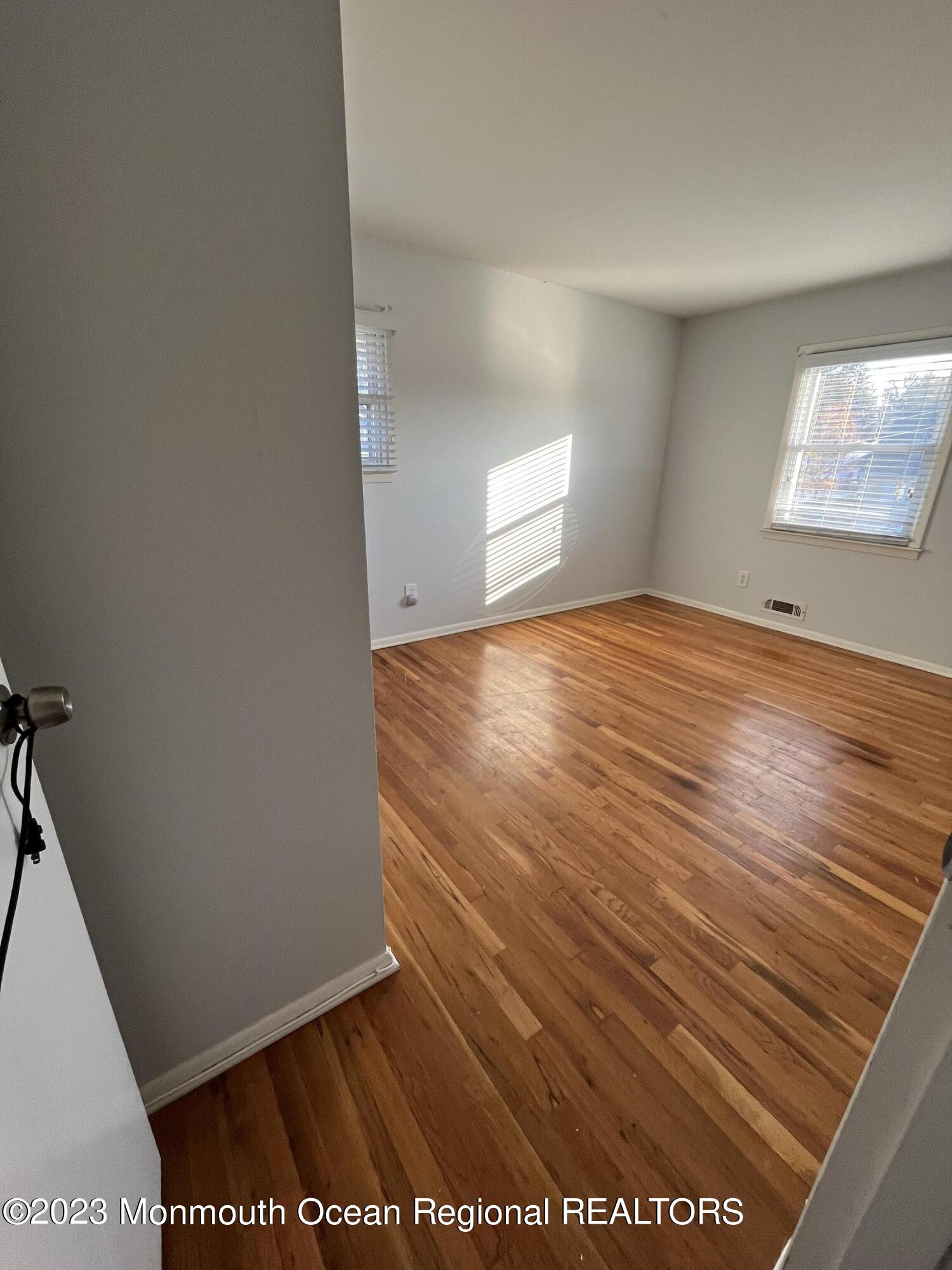 42 Epping Drive Kenilworth, NJ 07033 - Photo 12 of 22 a view of an empty room and window
