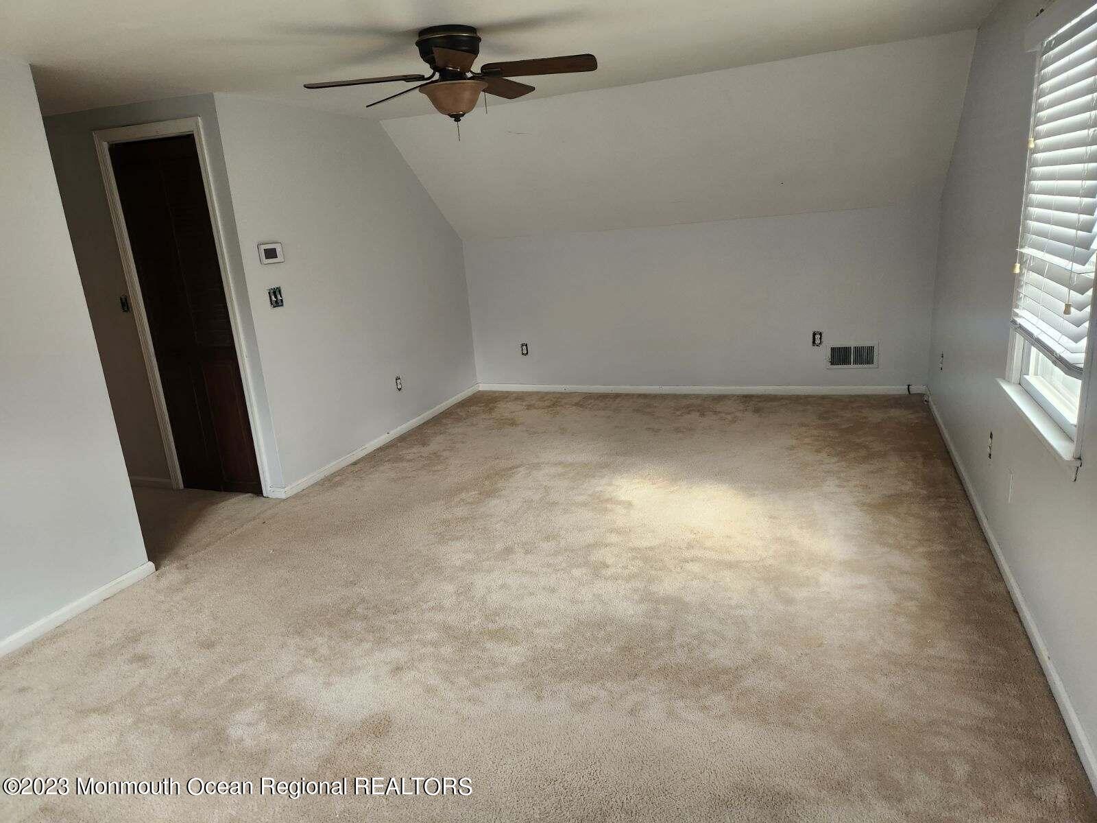 42 Epping Drive Kenilworth, NJ 07033 - Photo 13 of 22 an empty room with windows