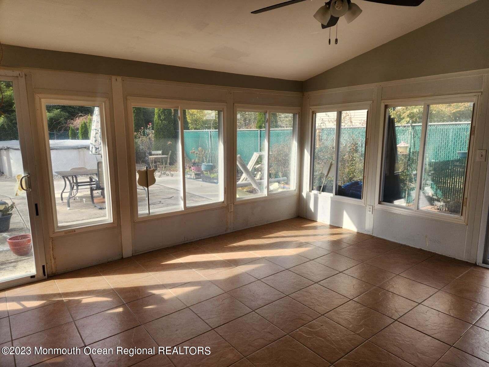 42 Epping Drive Kenilworth, NJ 07033 - Photo 16 of 22 a view of an empty room with windows