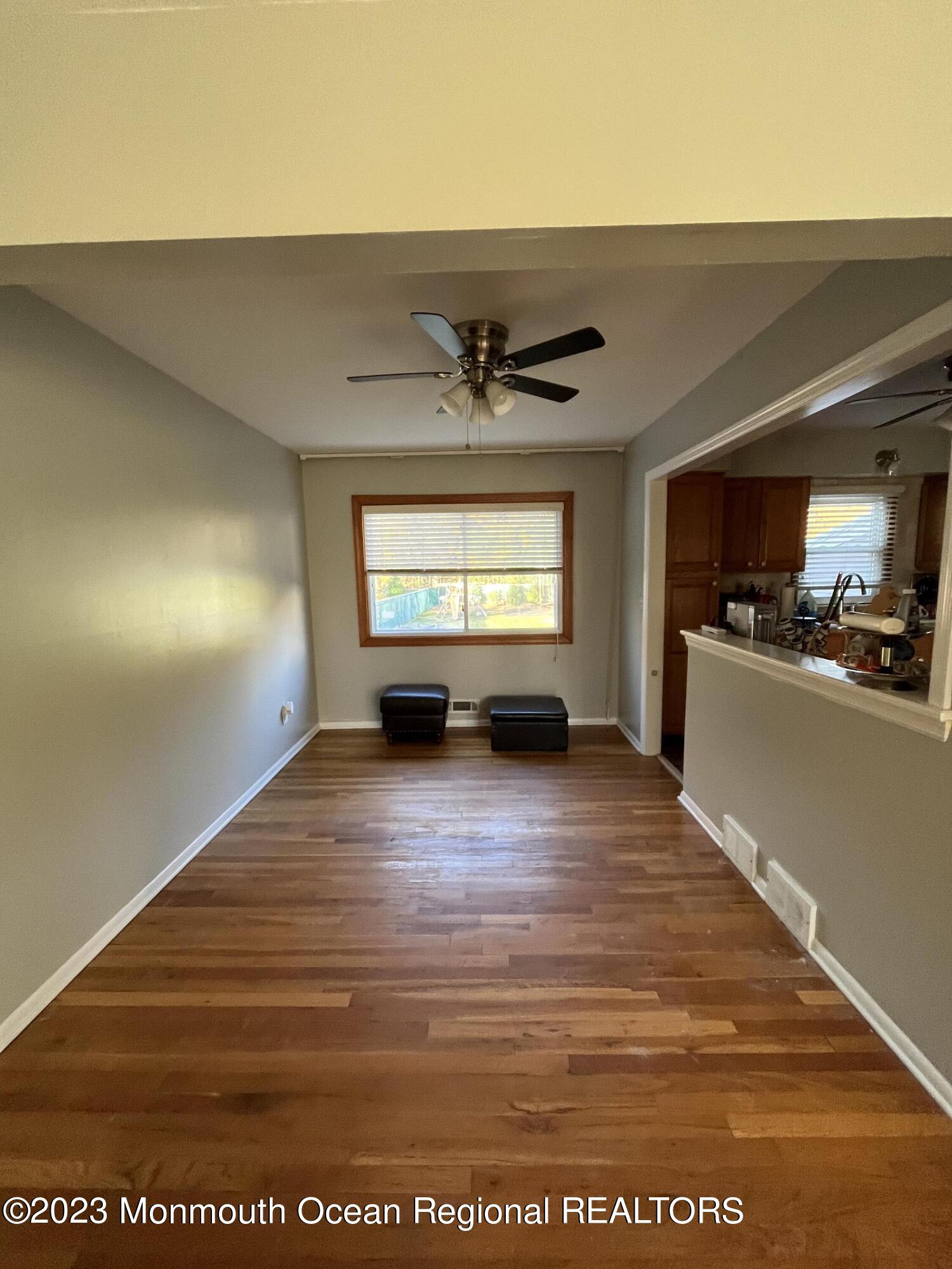 42 Epping Drive Kenilworth, NJ 07033 - Photo 5 of 22 a view of empty room with wooden floor and window