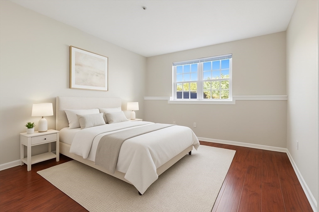 360 Neponset Street, Unit 702 Canton, MA 02021 - Photo 14 of 21 a bedroom with a bed and a window