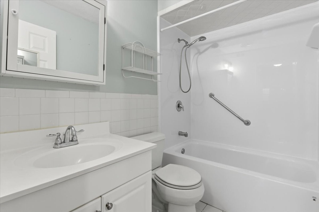 360 Neponset Street, Unit 702 Canton, MA 02021 - Photo 16 of 21 a bathroom with a sink toilet and shower
