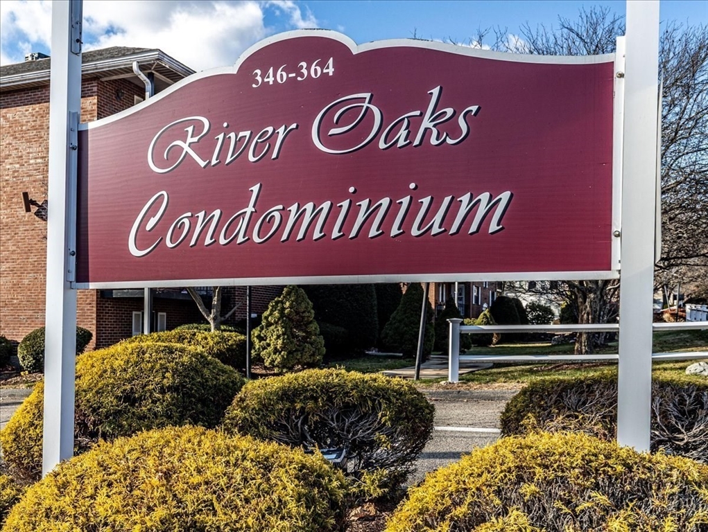360 Neponset Street, Unit 702 Canton, MA 02021 - Photo 20 of 21 a view of outdoor space with signage and flags