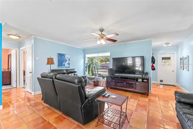 a living room with furniture and a flat screen tv
