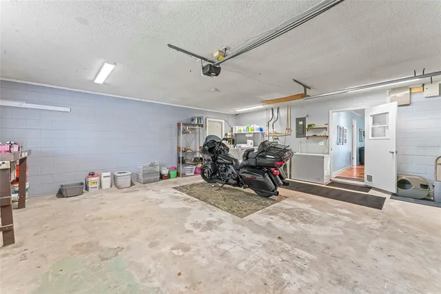 a view of a livingroom with workspace and a window