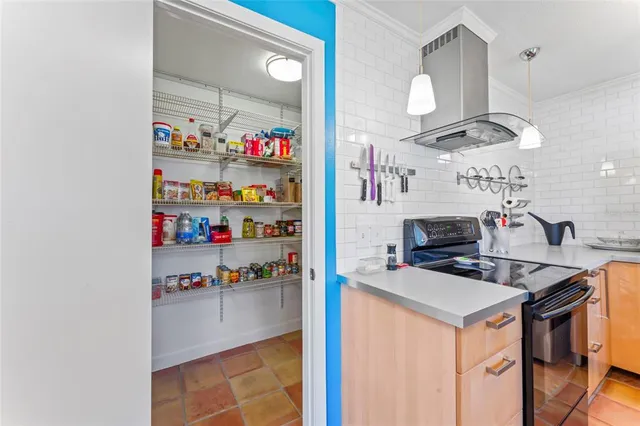 a kitchen with stainless steel appliances granite countertop a stove and a microwave