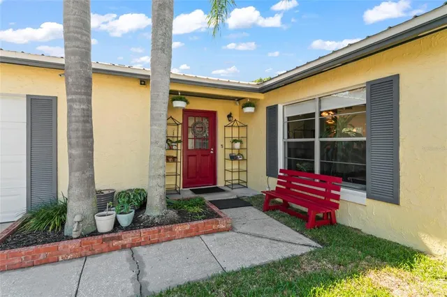 a flower garden is sitting in front of a building