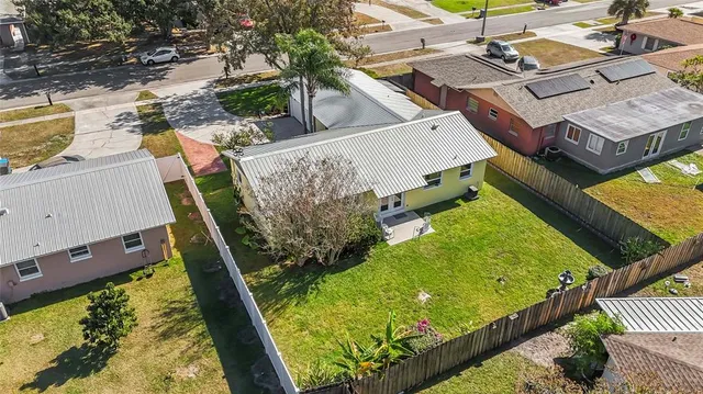 an aerial view of a house with a garden and plants