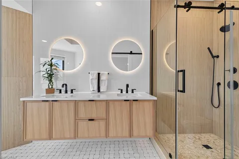 a bathroom with a sink and mirror