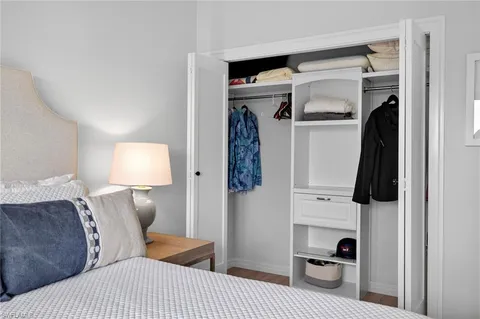 a bedroom with a bed and a closet