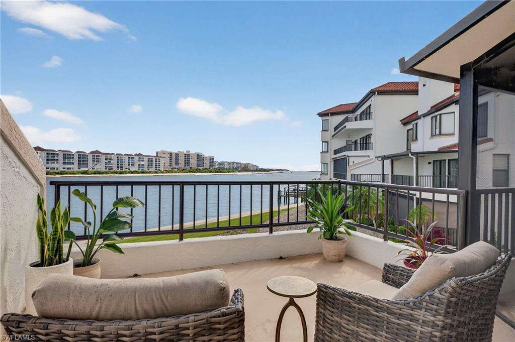 111 La Peninsula Boulevard, Unit 111 Naples, FL 34113 - Photo 28 of 33 a view of balcony with furniture