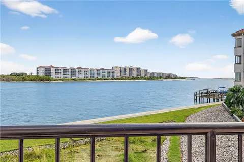 a view of swimming pool with outdoor space and lake