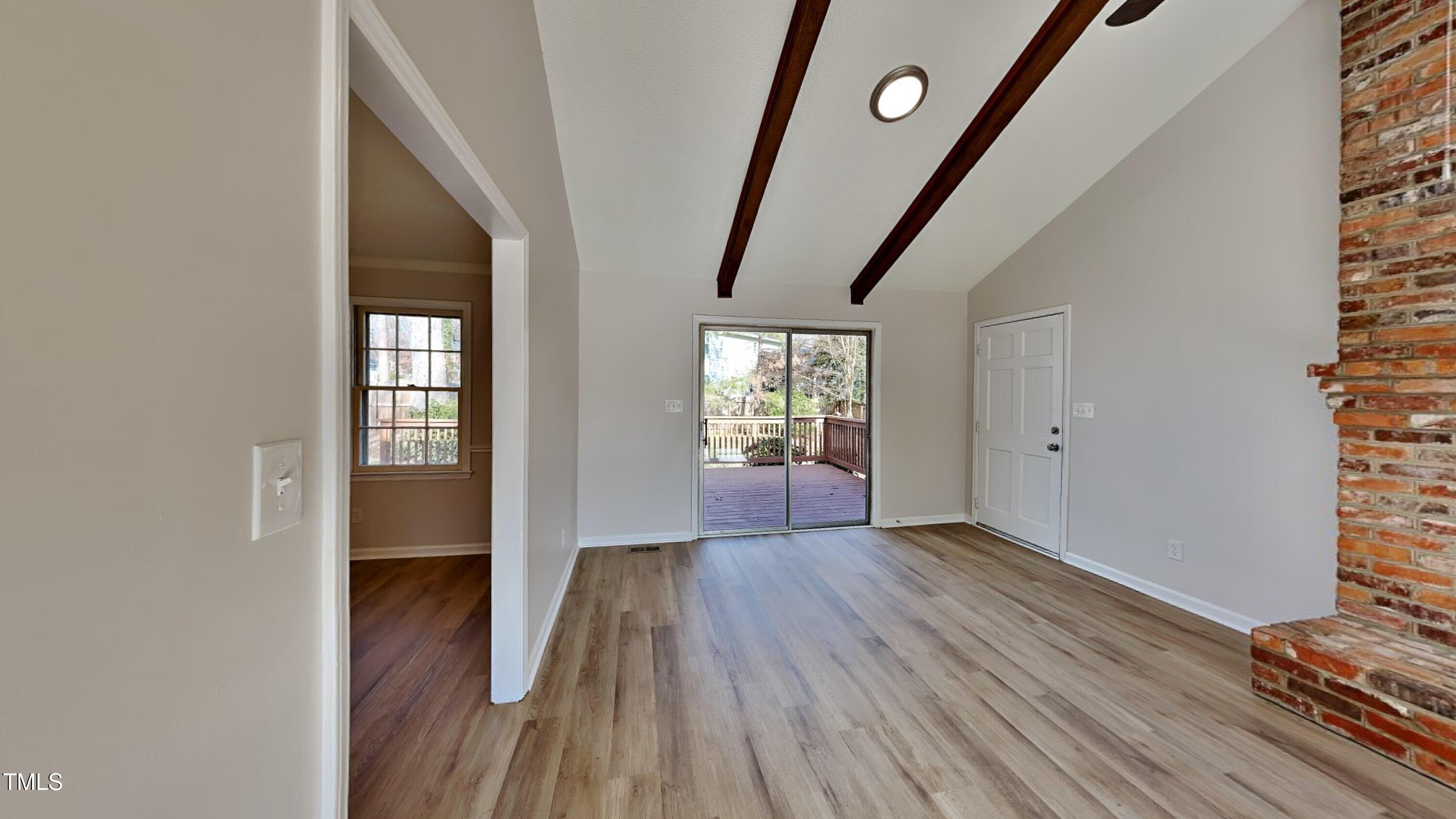 1921 Port Royal Road Raleigh, NC 27609 - Photo 4 of 18 wooden floor in an empty room with a window