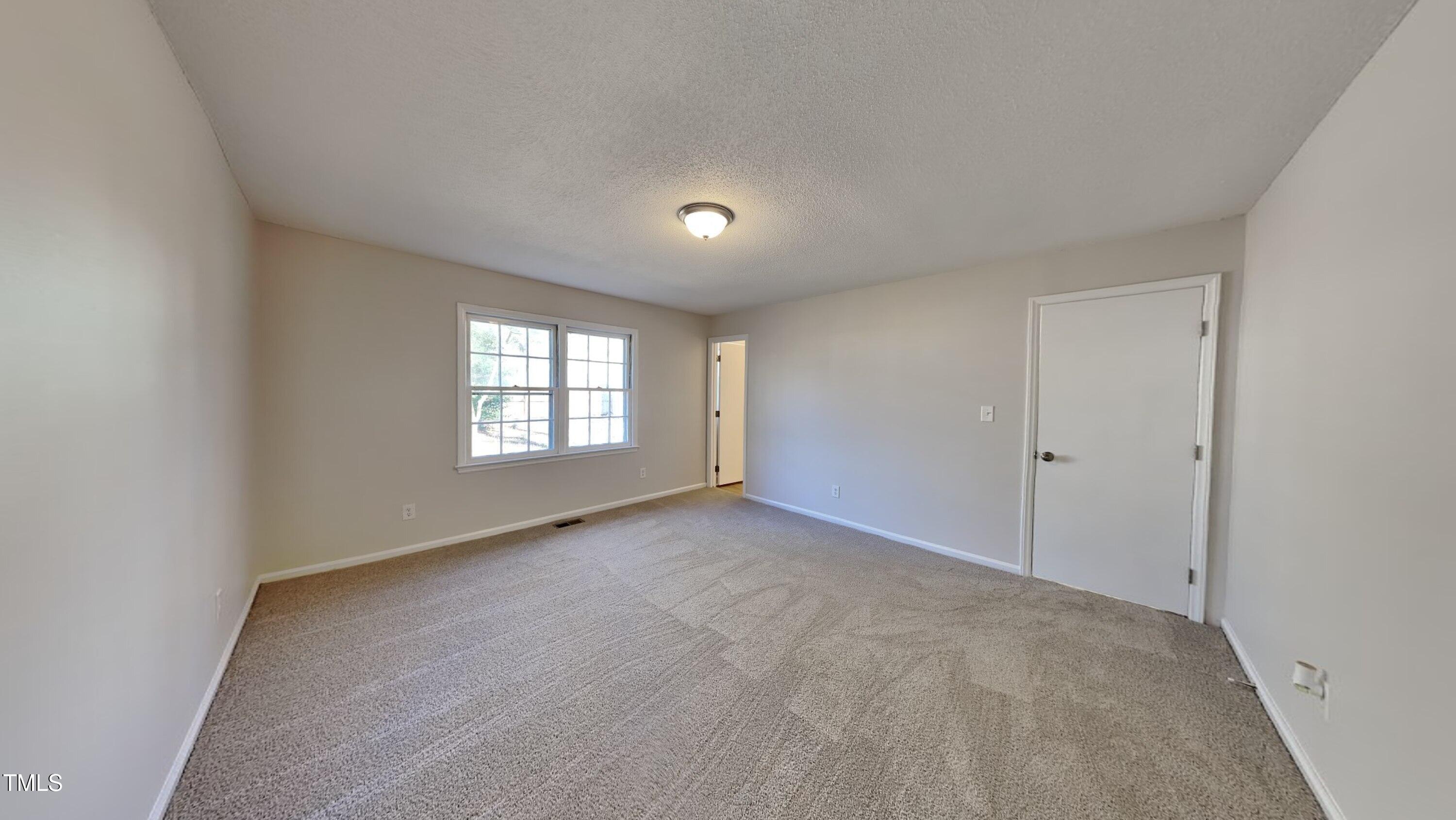 1921 Port Royal Road Raleigh, NC 27609 - Photo 9 of 18 a view of an empty room with a window
