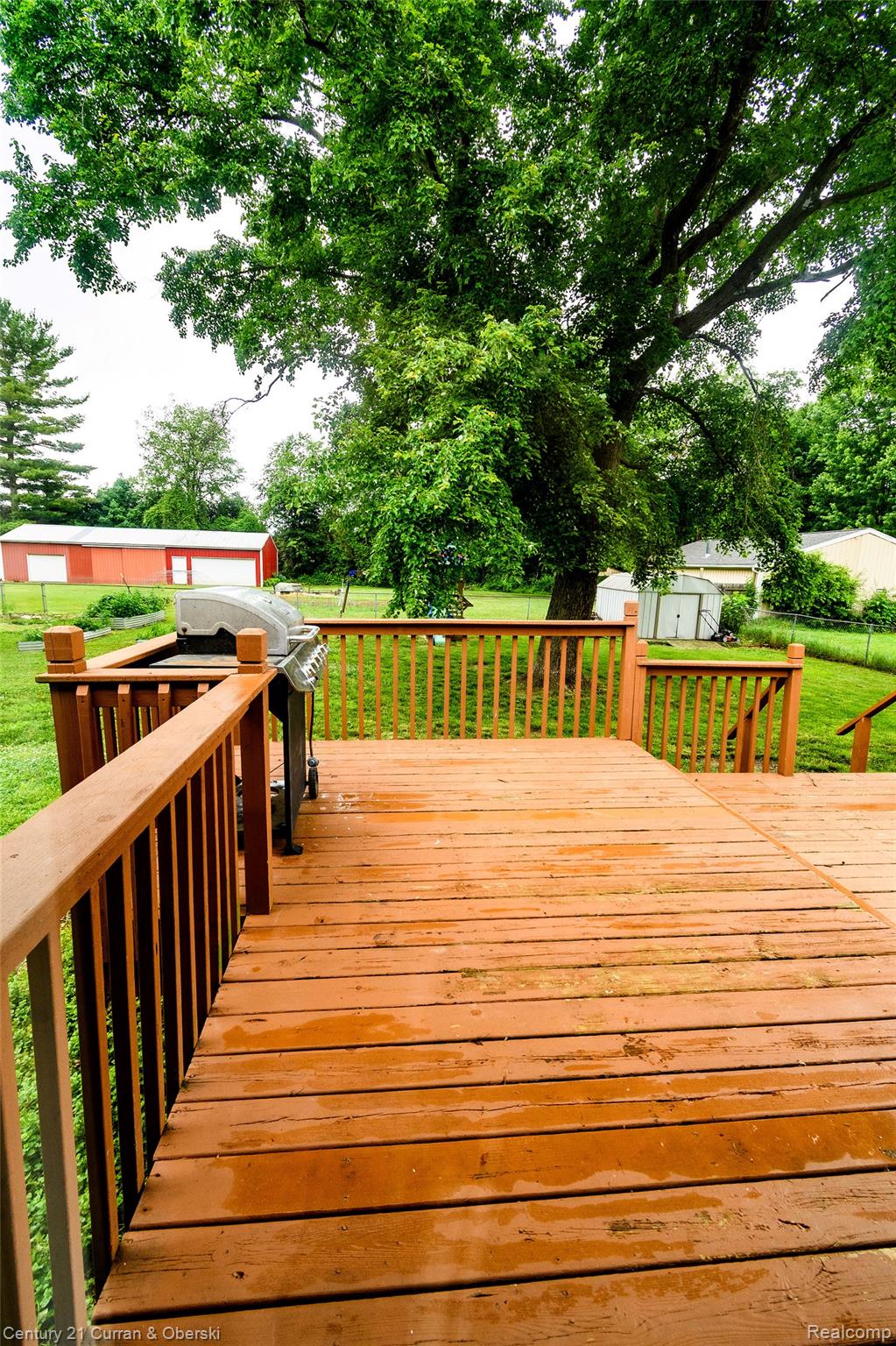 5260 Rives Junction Road Jackson, MI 49201 - Photo 37 of 44 Expansive wood deck with natural wood railings