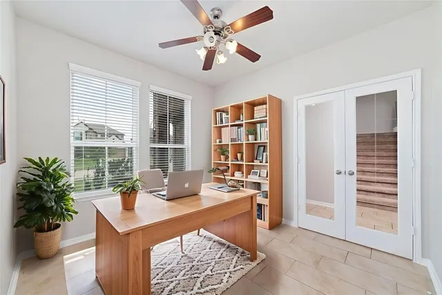 a workspace with furniture and a potted plant