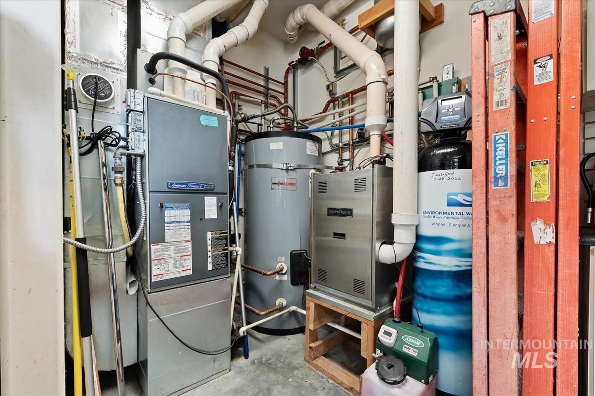 106 Hidden Hollow Road Hailey, ID 83333 - Photo 47 of 49 Utility space featuring a water heater, furnace, and water filtration system