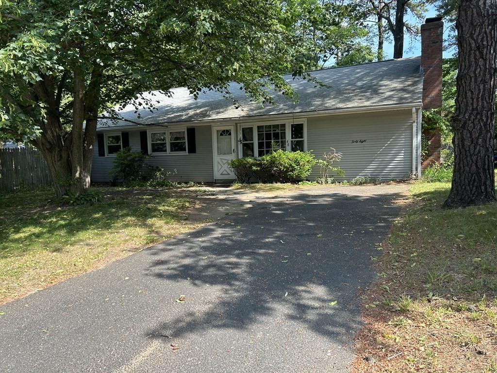 48 Emerald Road Springfield, MA 01119 - Photo 1 of 10 a front view of a house with a yard and garage