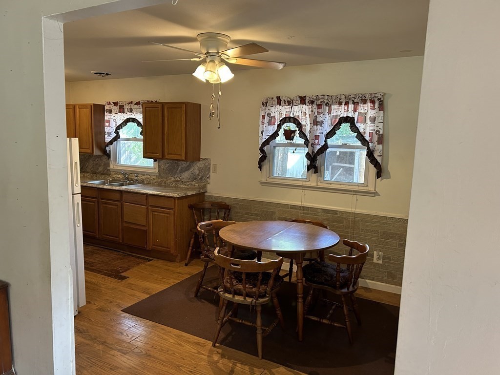 48 Emerald Road Springfield, MA 01119 - Photo 4 of 10 a view of a dining room with furniture and wooden floor
