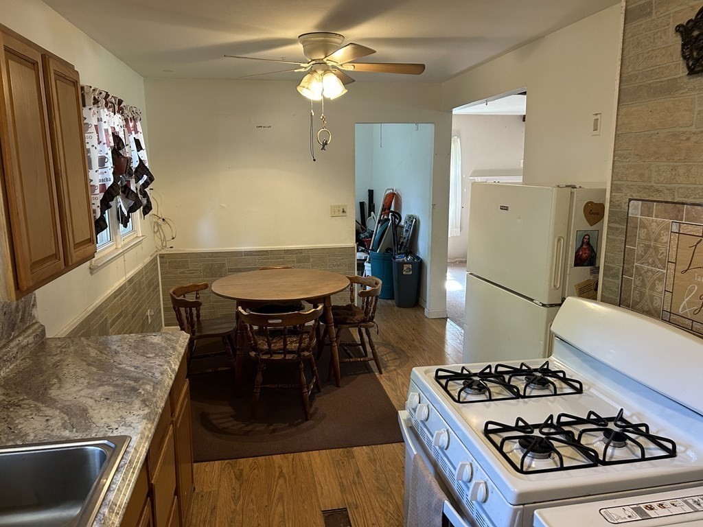 48 Emerald Road Springfield, MA 01119 - Photo 5 of 10 a kitchen with a stove and a refrigerator