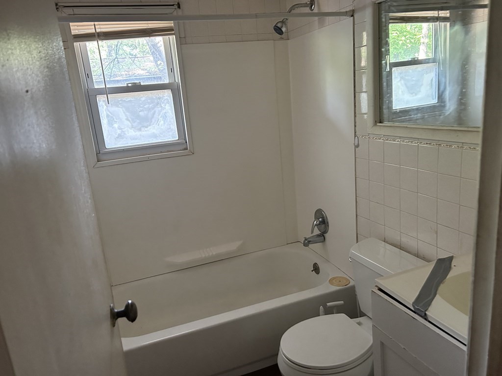 48 Emerald Road Springfield, MA 01119 - Photo 8 of 10 a bathroom with a toilet bathtub window and shower