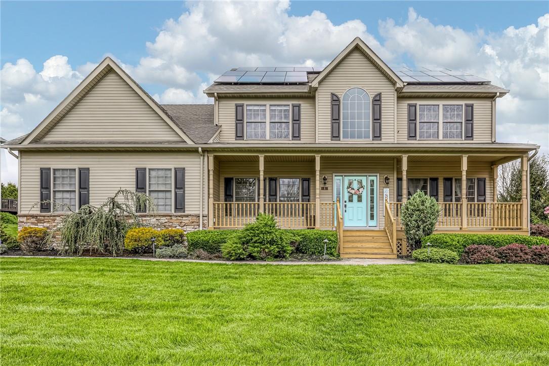 front view of a house with a yard