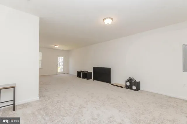 a view of a livingroom with a staircase