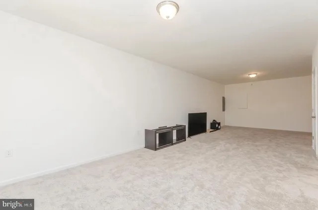 a bathroom with a sink a toilet a mirror and shower curtain