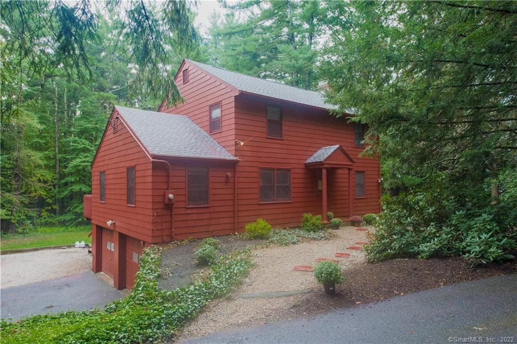43 Canton Road Simsbury, CT 06070 - Photo 1 of 1 a view of a brick house with a yard and large tree