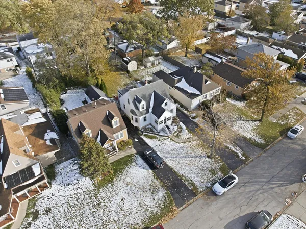 a aerial view of a house with swimming pool