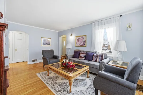 a living room with furniture and a rug