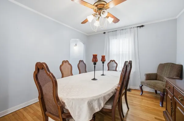 a view of a dining room with furniture and wooden floor