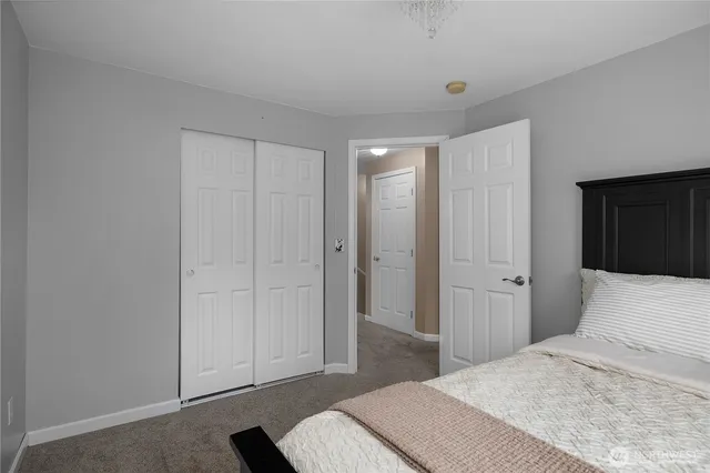 a bedroom with a bed and a view of bedroom