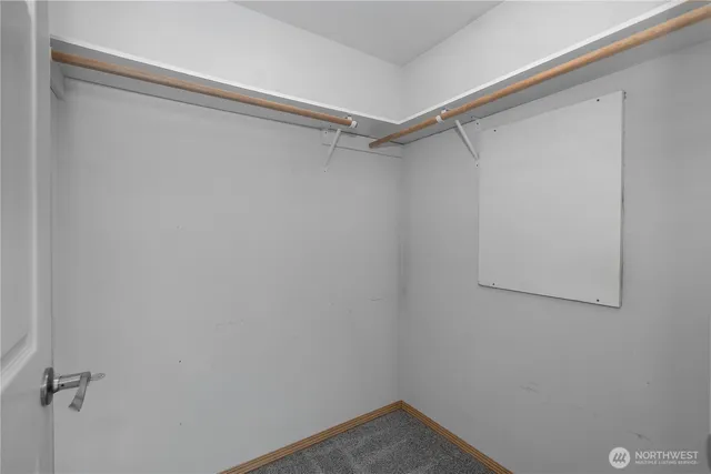a view of a room with shelf on the wall
