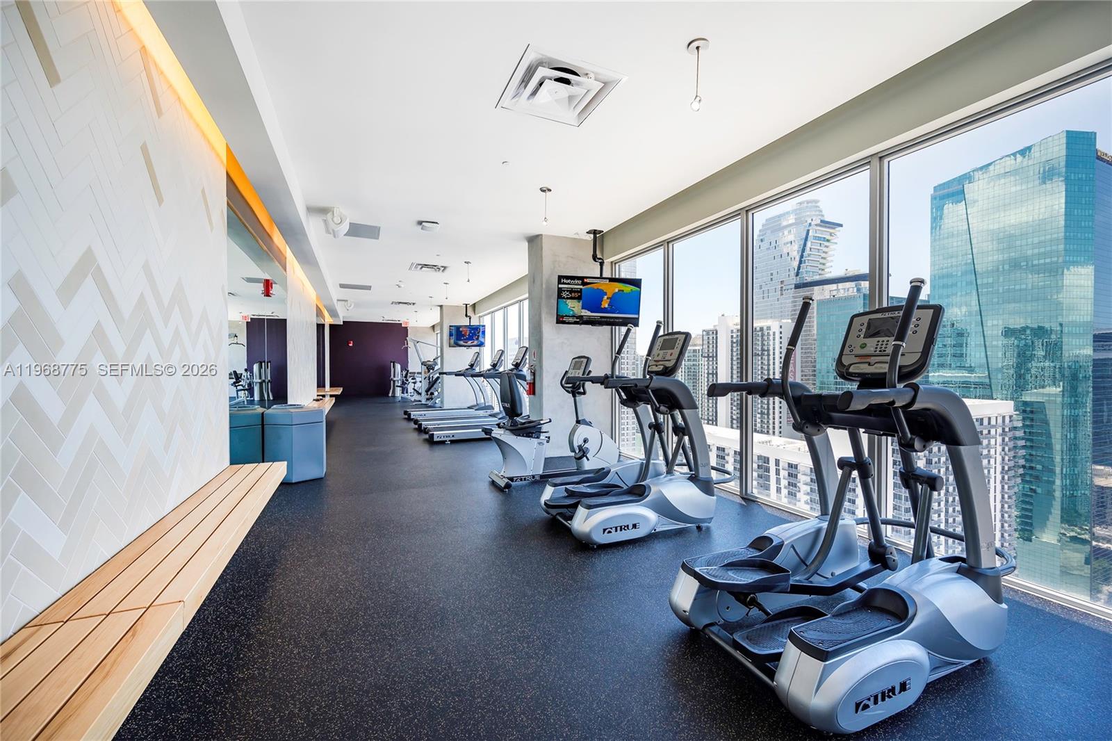 151 Southeast 1st Street, Unit 909 Miami, FL 33131 - Photo 15 of 29 a view of a room with gym equipment