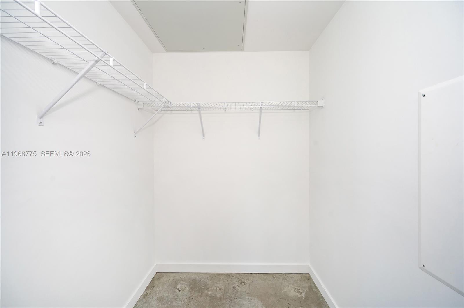 151 Southeast 1st Street, Unit 909 Miami, FL 33131 - Photo 10 of 29 a view of small space with empty racks