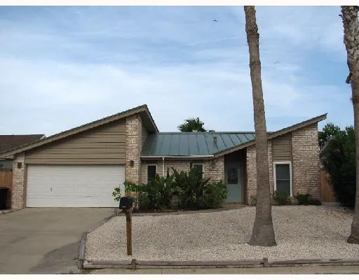 a front view of a house with garage