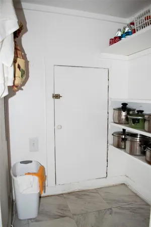 a kitchen with a refrigerator and cabinets