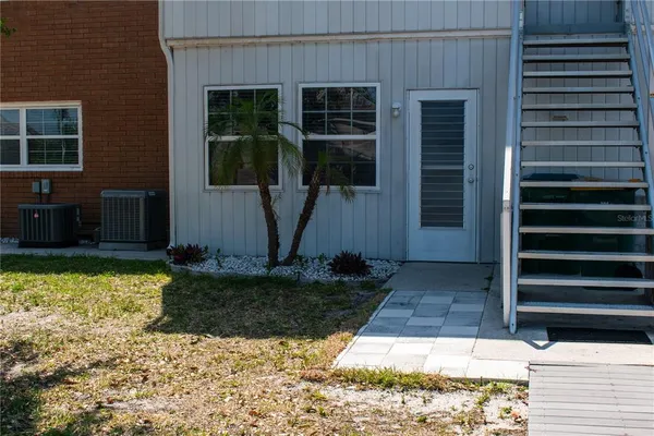 a view of house with backyard porch and entertaining space