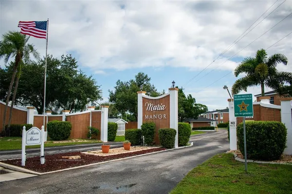 a view of a street with cars park view