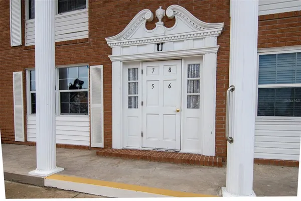 a front view of a house with a empty space