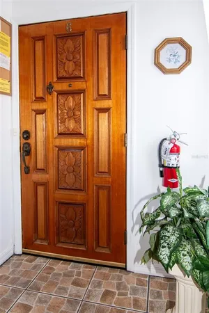an entryway with wooden floor