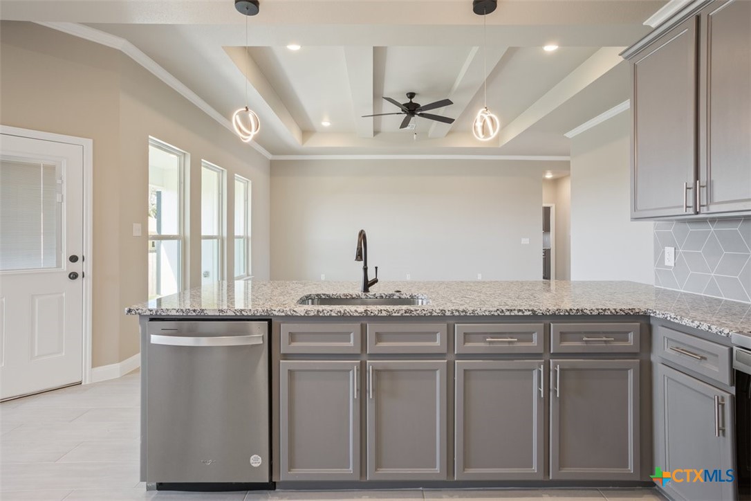 3824 Keller Road Temple, TX 76504 - Photo 12 of 28 a kitchen with granite countertop cabinets a sink and appliances